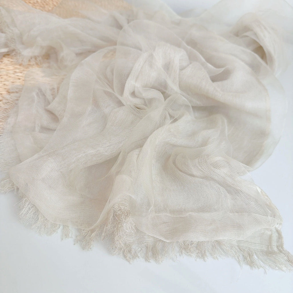 Lightweight Gauze Scarf in Cream — flat lay draped
