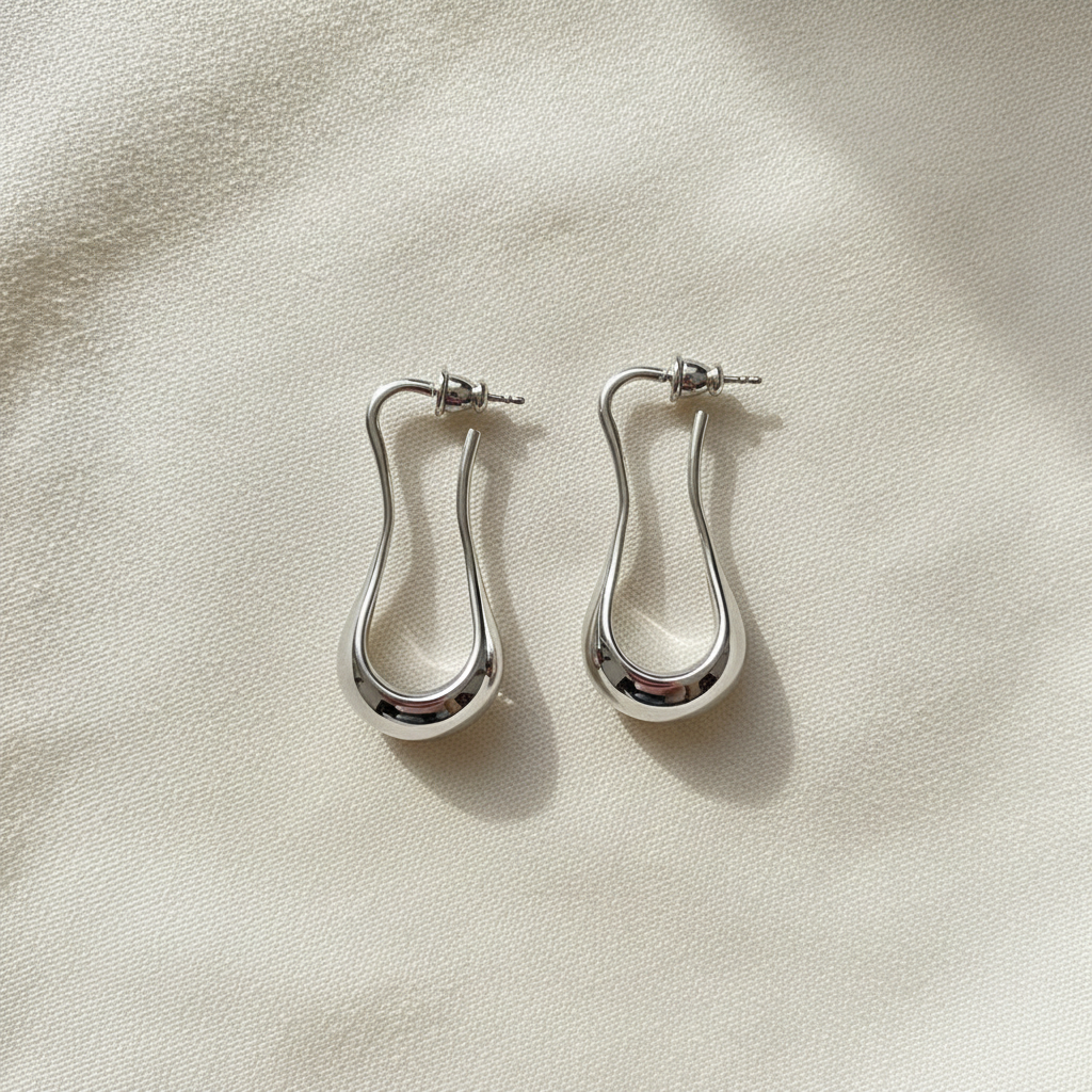 Retro Liquid Twist Hoop Earrings · Silver